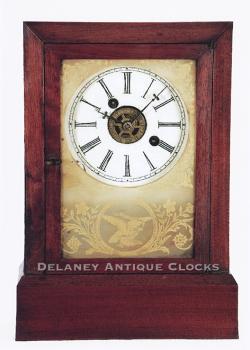 Atkins Clock Company of Bristol, Connecticut. A Cottage Clock with a time and alarm movement retailed by Daniel Pratt & Sons. L-508.